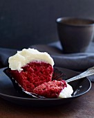 A beetroot cupcake with creamy frosting