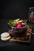 Chocolate mousse with fruit and biscuits