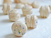 Macarons with a white chocolate & cinnamon filling topped with sprinkles