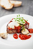 Beefsteak with goat's cheese, mushrooms and tomato sauce