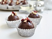 Chocolate truffles with lingonberries and almonds