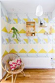 Graphic design of yellow and marbled triangles on wall