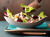 A mixed leaf salad with smoked trout