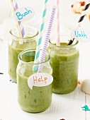 Green smoothies for Halloween decorated with straws and speech bubbles