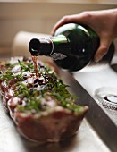Saddle of lamb with rosemary and port wine being made