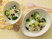 Potatoes in a creamy sauce with broccoli and pumpkin seeds
