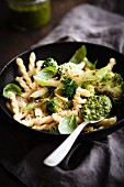 Vegan pasta with broccoli, walnut pesto and basil