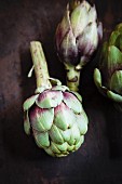 Three fresh artichokes