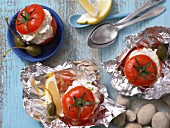 Tomatoes filled with ricotta and aerved with herbs and capers