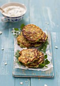 Zucchini fritters with feta, parsley and dill, served with tzatziki