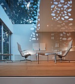 Elegant living room with glass wall in modern, architect-designed house