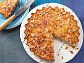 Rice pudding & rhubarb tart with flaked almonds