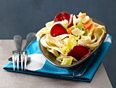 Pasta nests with beetroot and carrots
