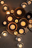 Candles in pots and glasses (top view)