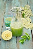 Detox cucumber lemonade with elderflower syrup and mint