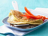 Cheese omelette with red pepper on wholemeal bread