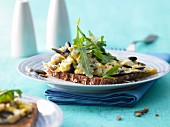 Scrambled egg with crunchy seeds on wholemeal bread with rocket