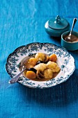 Yeast dumplings with dried fruit compote