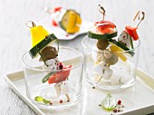 Mozzarella kebabs with courgette, peppers and olives
