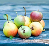 Apples and pears on a wooden table