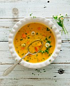 Carrot soup with daisies