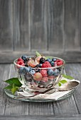Fresh berry salad with chia seeds and mint