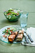 Fish parcels with cod and salmon served with Asian salad
