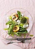 A salad with nectarine, feta and basil & mint dressing