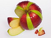 An apple made from wedges from two different-coloured apples