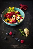 Colourful fruit salad with ginger