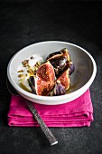 Fresh figs with a carmel sauce, yoghurt and pistachio nuts