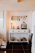 Christmas arrangement on sideboard below mirror in niche