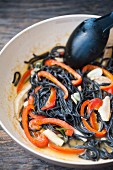 Black squid ink pasta with mushrooms and pepper