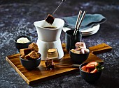Fondue with assorted ingredients