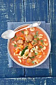 Tomato soup with meatballs, pasta and vegetables