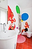 Guest WC with pin-up murals and magazine rack on wall
