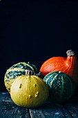 Assorted pumpkin varieties on a wooden table