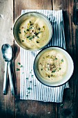 Yellow courgette soup with fresh thyme, walnuts and pepper