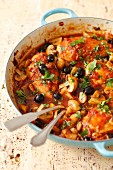 Chicken cacciatore: chicken breast braised in tomato sauce with mushrooms and olives