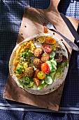 Falafel with vegetables on pitta bread