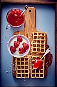 Waffles with raspberries and strawberry coulis