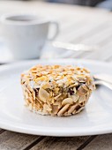 A gluten-free almond flour cake with flaked almonds