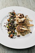 Tofu & nut patties with king trumpet mushroom sauce and black quinoa