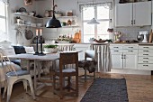 Rustic dining table in white, country-house-style kitchen-dining room