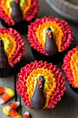 Cupcakes decorated with buttercream turkeys