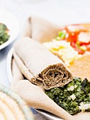 Rolled Ethiopian injera flatbread made with teff flour