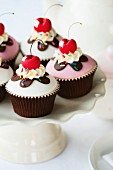 Cherry cupcakes on a cake stand