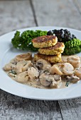 Black salsify and mushrooms in white wine sauce with millet seed burgers