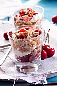 Cherry desserts with yoghurt and flakes