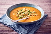 Pumpkin soup with rice, quinoa and peas